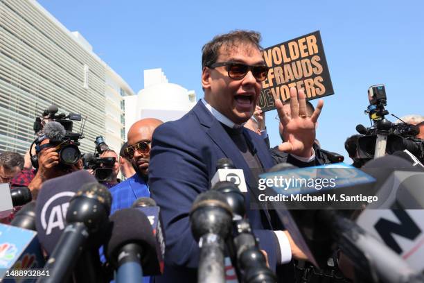 Rep. George Santos speaks with members of the press as he leaves Federal Court on May 10, 2023 in Central Islip, New York. Federal prosecutors in the...