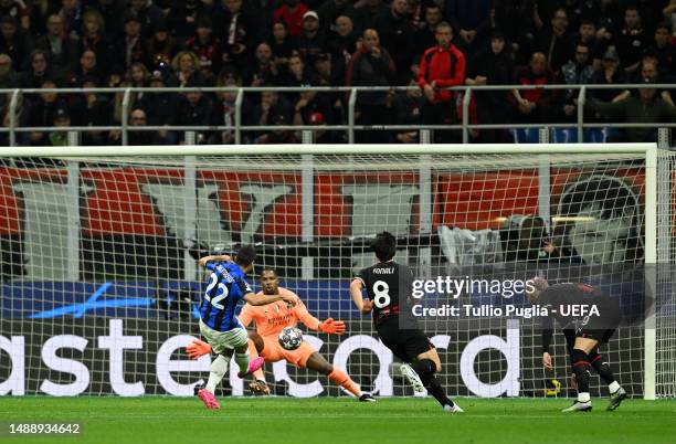 Henrikh Mkhitaryan of FC Internazionale scores the team's second goal as Mike Maignan of AC Milan fails to make a save during the UEFA Champions...