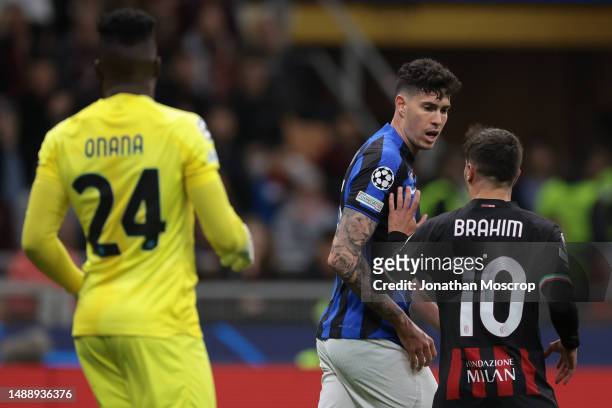 Andre Onana of FC Internazionale looks on as Brahim Diaz of AC Milan clashes with Alessandro Bastoni of FC Internazionale during the UEFA Champions...