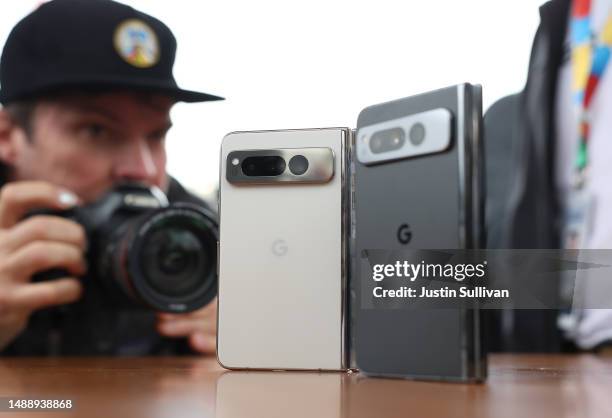 Member of the media inspects the new Google Pixel Fold phone during the Google I/O developers conference at Shoreline Amphitheatre on May 10, 2023 in...