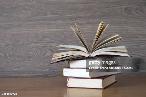 close-up of books on table,romania - rechtschreibung stock-fotos und bilder