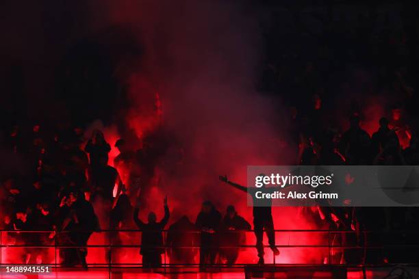 General view as fans of AC Milan use Smoke Flares during the UEFA Champions League semi-final first leg match between AC Milan and FC Internazionale...