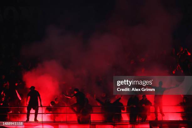 General view as fans of AC Milan use Smoke Flares during the UEFA Champions League semi-final first leg match between AC Milan and FC Internazionale...