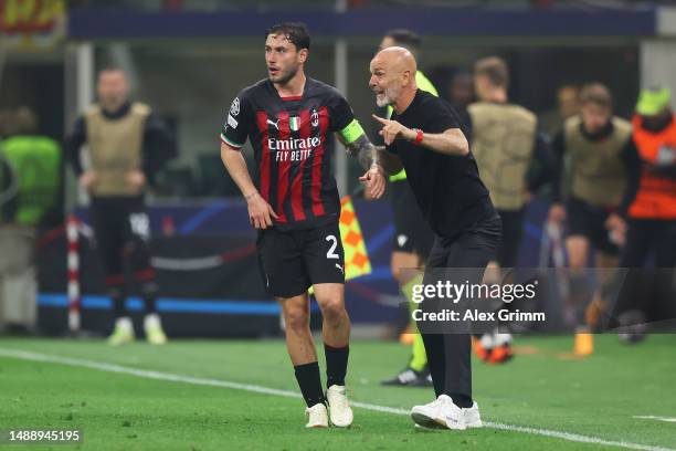 Davide Calabria of AC Milan speaks with Stefano Pioli, Head Coach of AC Milan, during the UEFA Champions League semi-final first leg match between AC...