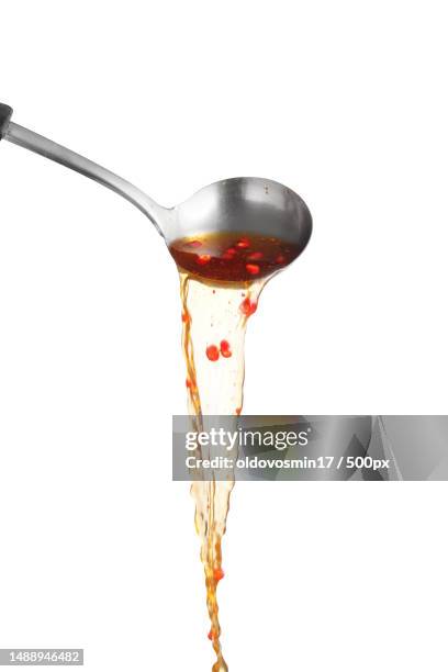 dipper pouring spicy noodle soup on white background,soup for sukiyaki from chicken and fish,romania - utensile di portata foto e immagini stock