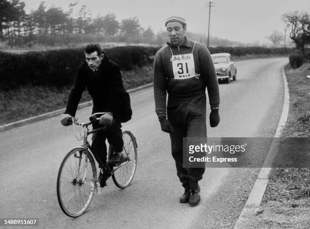 Year-old miner Alfred Rozenthals in the lead passing through Whitchurch, Shropshire, during the John o' Groats to Land's End walking race organised...