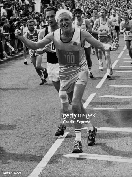 English DJ and television presenter, Jimmy Savile running in the second London marathon race on 9th May 1982.