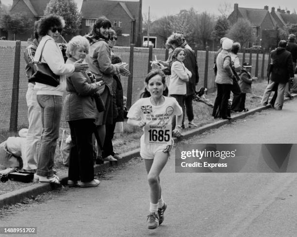 Year-old Cheryl Page running a 26-mile course at Abingdon, Oxfordshire, 4th May 1982. Cheryl - who is not yet permitted to compete in the London...