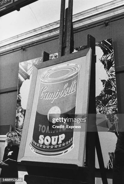 Andy Warhol's 'Colored Campbell’s Soup Can' is displayed on an easel at Sotheby's auction house where it has sold for £8500, London, 5th December...