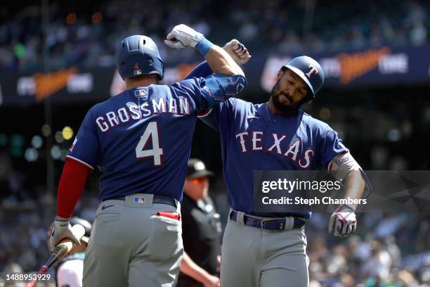 Marcus Semien of the Texas Rangers celebrates his home run with against the Seattle Mariners during the third inning at T-Mobile Park on May 10, 2023...