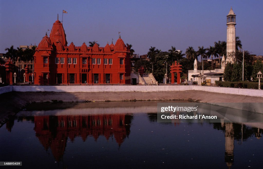 The Digambara Jain Temple by the banks of a body of water.