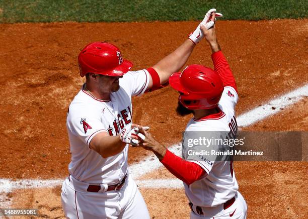 Hunter Renfroe and Anthony Rendon of the Los Angeles Angels celebrate a home run against the Houston Astros in the second inning at Angel Stadium of...