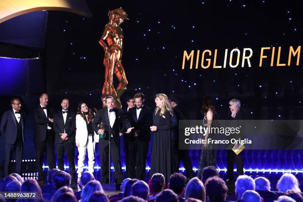 Charlotte Vandermeersch and Felix van Groeningen receive the David di Donatello for David di Donatello for Best Film Award from Carlo Conti during...