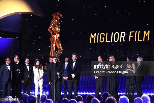 Luca Marinelli and Alessandro Borghi speak on stage as Charlotte Vandermeersch and Felix van Groeningen receive the David di Donatello for David di...