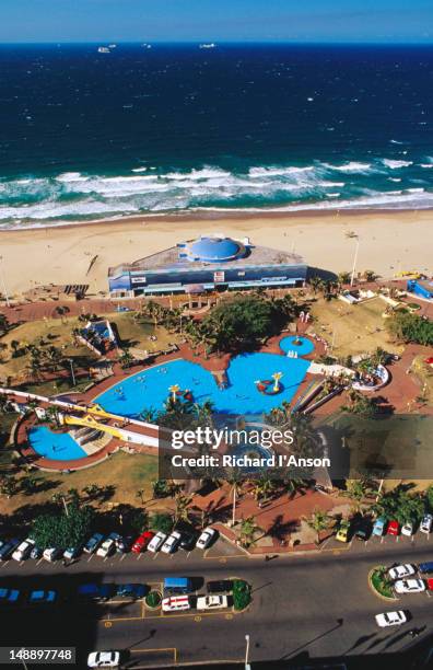 swimming pool on the promenade. - durban sky stock pictures, royalty-free photos & images