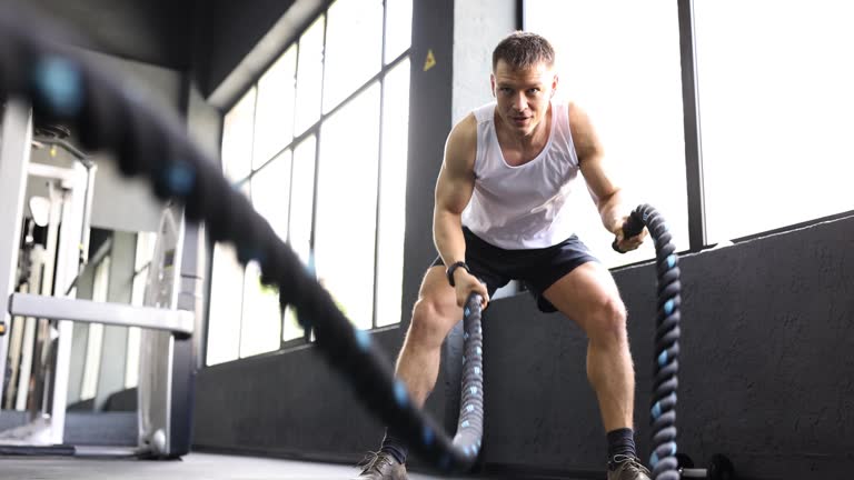 Three Waving Ropes Man athlete waving ropes in gym 4k movie slow motion 동영상 (1488999735 ...