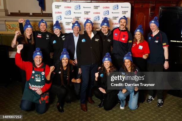 Neale Daniher - FightMND Patron poses for a photo with players and sponsors during media opportunity in the Melbourne Town Hall for the launch of the...