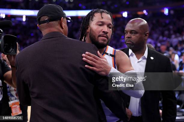 Jalen Brunson of the New York Knicks celebrates with former New York Knicks John Starks after defeating the Miami Heat in game five of the Eastern...