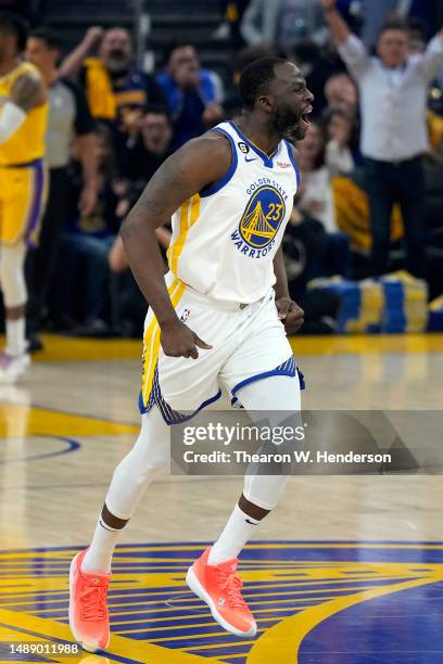 Draymond Green of the Golden State Warriors reacts after a three point basket against the Los Angeles Lakers during the first quarter in game five of...