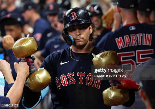 Triston Casas of the Boston Red Sox celebrates hitting a two-run homer in the ninth inning against the Atlanta Braves at Truist Park on May 10, 2023...