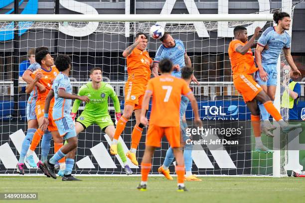 Brandon Vázquez of FC Cincinnati scores a goal against Maxime Chanot of New York City during the second half of a U.S. Open Cup Round of 32 soccer...