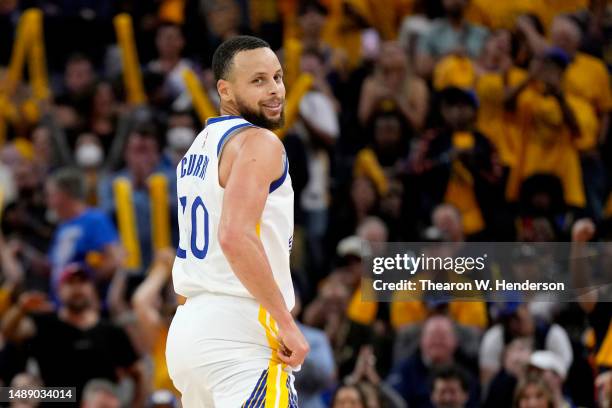 Stephen Curry of the Golden State Warriors reacts after scoring during the fourth quarter against the Los Angeles Lakers in game five of the Western...