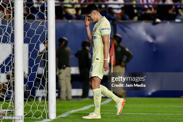 Israel Reyes of America leaves the pitch after receiving a red card during the quarterfinals first leg match between Atletico San Luis and America as...