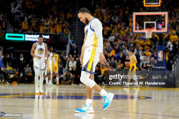 Stephen Curry of the Golden State Warriors walks off the court at the end of the first half against the Los Angeles Lakers in game five of the...