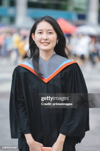 pround family on graduation day - thai ethnicity stock pictures, royalty-free photos & images