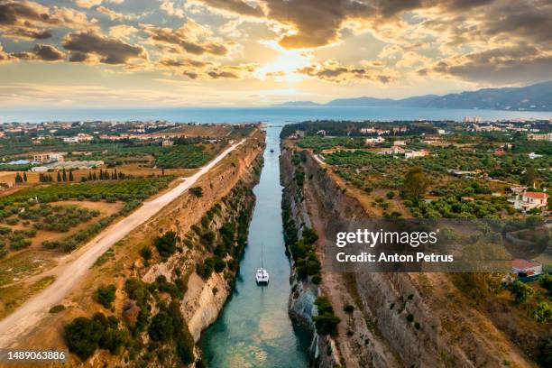 aerial view of corinth canal at sunset. greece - corinth canal stock pictures, royalty-free photos & images