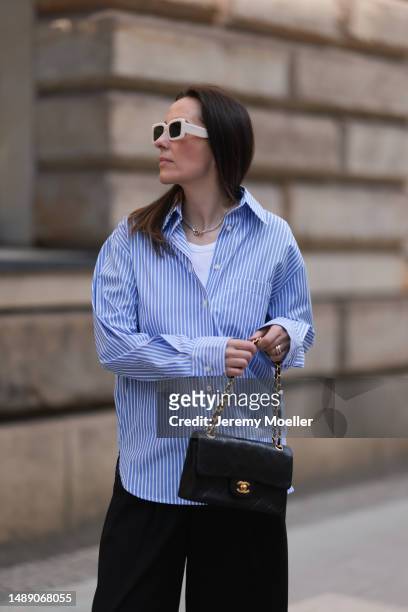 Elise Seitz seen wearing Soho Studios blue striped blouse, Hey Soho black wide pants, Zara white shades, Adidas samba black and white sneaker and a...