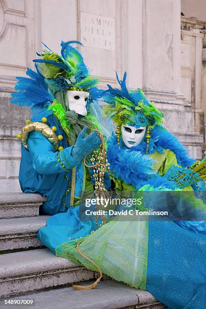 couple in carnival costumes and masks during the venice carnival, campo della salute, dorsoduro district. - santa maria della salute celebrations in venice stock pictures, royalty-free photos & images