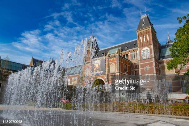 amsterdam rijksmuseum architecture in the  downtown canal district during summer - rijksmuseum amsterdam stock pictures, royalty-free photos & images