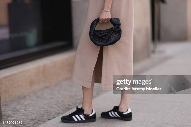 Elise Seitz seen wearing Hey Soho rose shirt dress, Adidas black and white samba sneaker, white Zara shades and Bottega Veneta mini Jodie black bag...