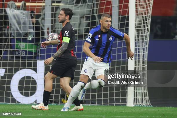 Edin Dzeko of FC Internazionale celebrates the team's first goal during the UEFA Champions League semi-final first leg match between AC Milan and FC...