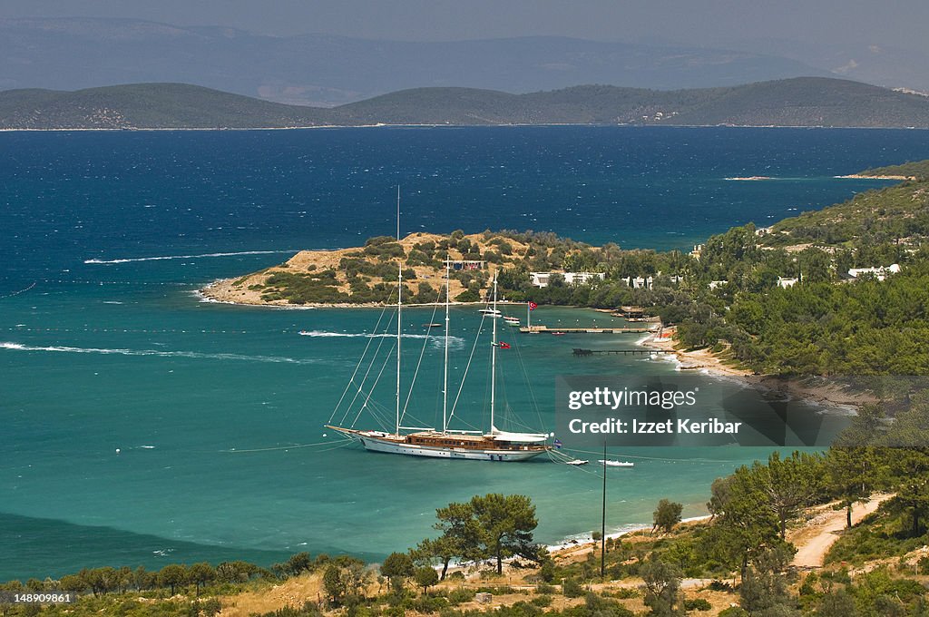 Gulet (traditional Turkish wooden sailing vessel) moored in bay.