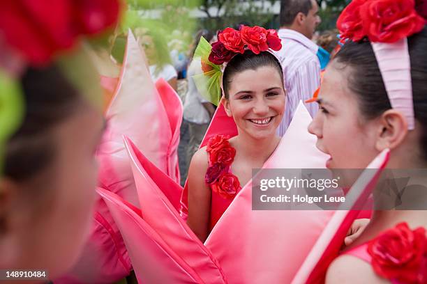 costumed participants prepare for parade at madeira flower festival. - carnival in portugal stock pictures, royalty-free photos & images