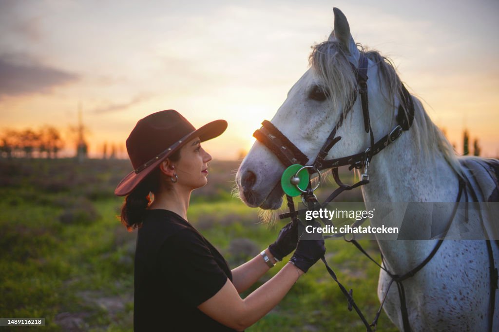 Happy girl playing with animals in corral ranch - Human and animals relationship concept