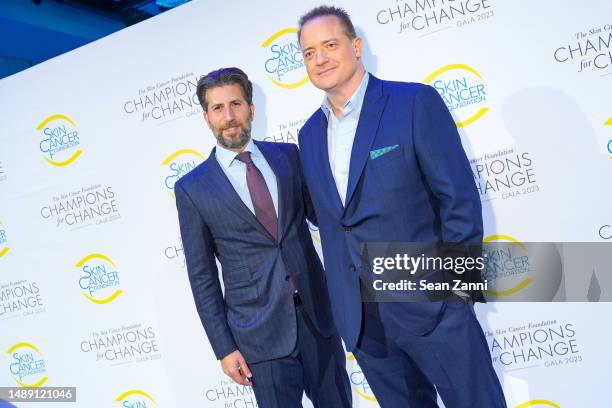 Adam Schweitzer and Brendan Fraser attend The Skin Cancer Foundation Champions for Change Gala at The Ziegfeld Ballroom on May 10, 2023 in New York...