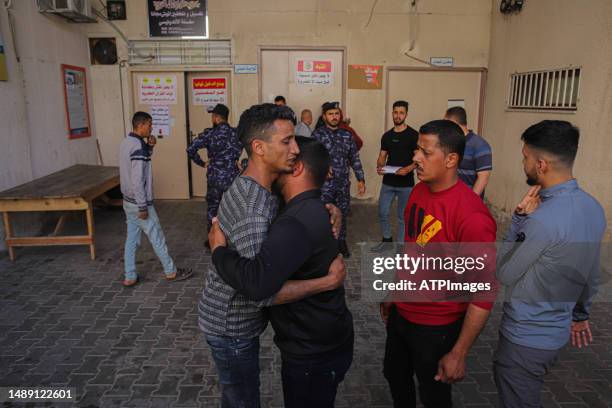 Relatives mourn outside the morgue of a hospital in Beit Lahia in the northern Gaza Strip. Israel and Gaza militants traded cross-border fire,...