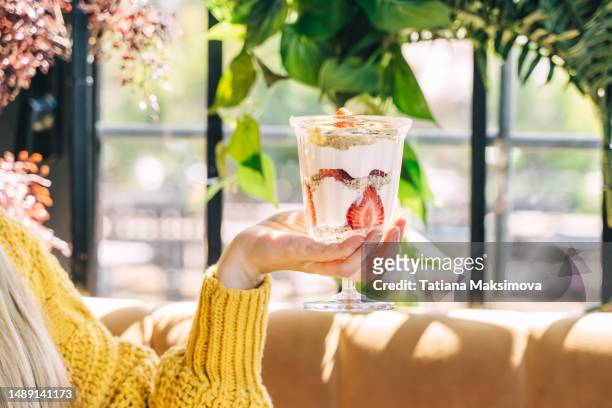 turkish dessert magnolia with strawberries in a beautiful vase in a summer restaurant. - trifle stock pictures, royalty-free photos & images