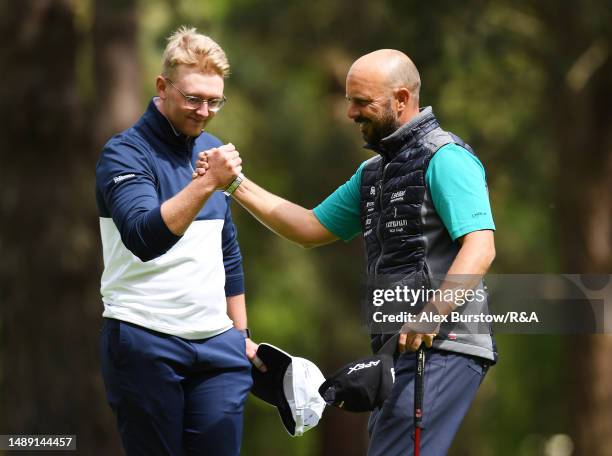 Tommaso Perrino of Italy shakes hands with Rasmus Lia of Sweden on the eighteenth green during Day Two of The G4D Open on the Duchess course at...