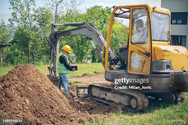 site supervisor at construction site - digging stock pictures, royalty-free photos & images