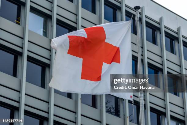 The Red Cross flag is seen flying at the Red Cross headquarters in Uccle commune on May 11, 2023 in Brussels, Belgium. The Red Cross announced last...