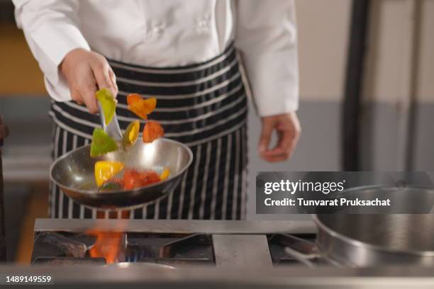 chef cooking at the kitchen . - baker smelling bread stock-fotos und bilder