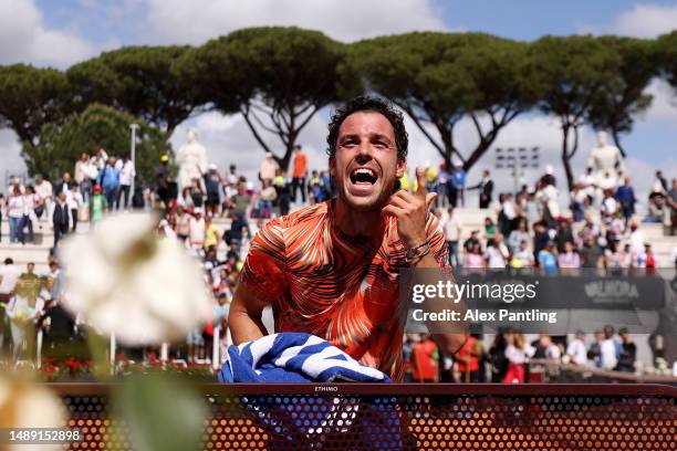 Marco Cecchinato of Italy celebrates victory against Mackenzie McDonald of the United States during the Men's Singles First Round match on Day Four...