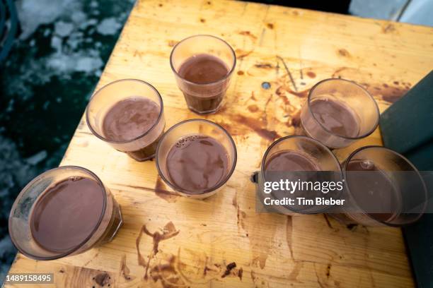 hot chocolate in plastic cups. - chocolate milk splash stock pictures, royalty-free photos & images