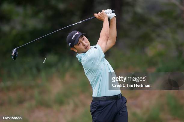 Sang-moon Bae of South Korea plays his shot from the 14th tee during the first round of the AT&T Byron Nelson at TPC Craig Ranch on May 11, 2023 in...
