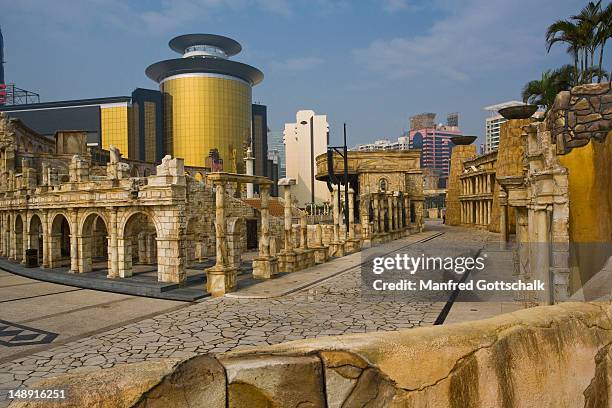 mock-up antique architecture of roman amphitheatre at fisherman's wharf, with sands casino gold glass panel in background. - sands hotel & casino stock pictures, royalty-free photos & images