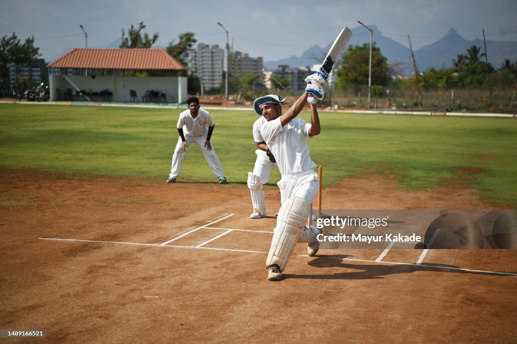 Batsman playing a big shot during a Cricket match
